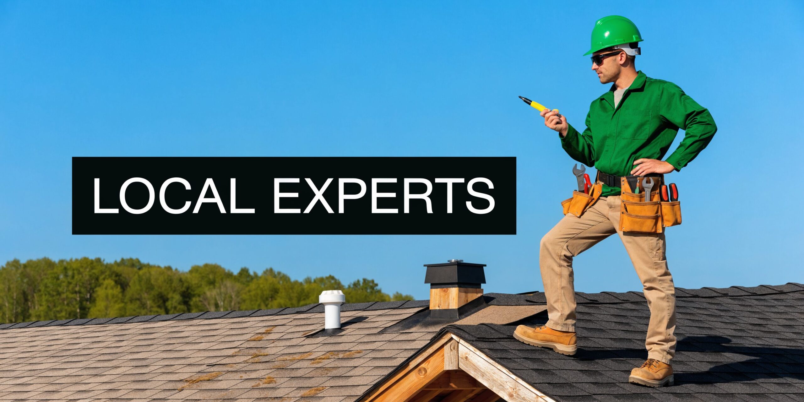 A professional construction worker wearing a green hard hat and tool belt stands on a residential roof.
