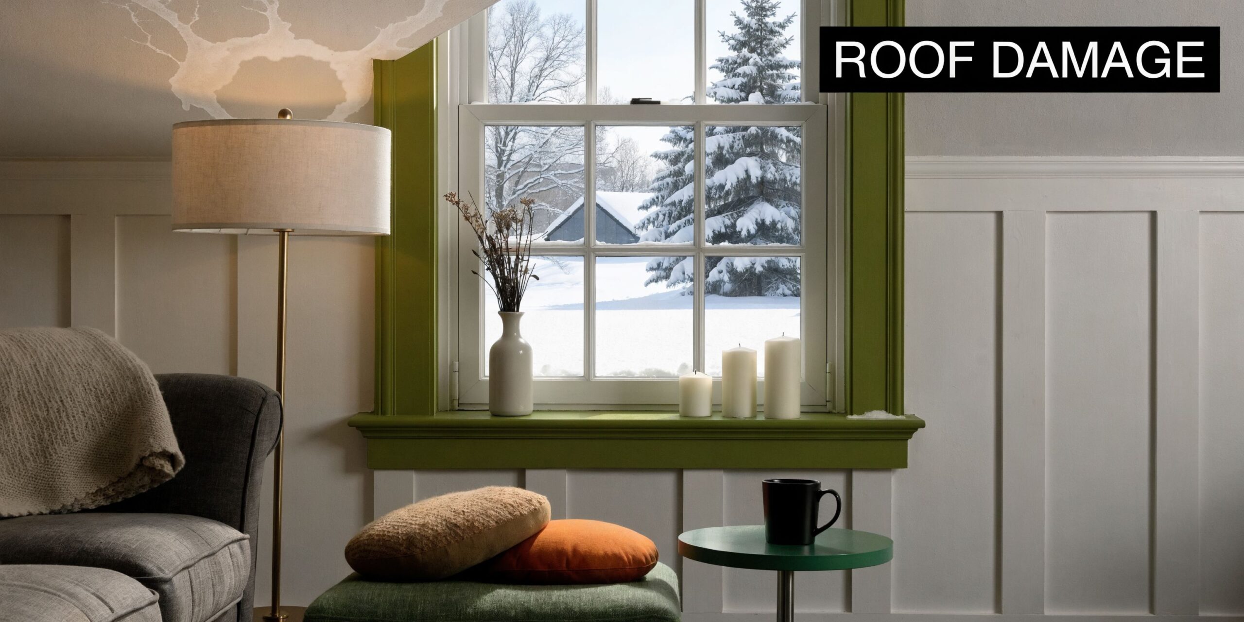 An indoor living room scene featuring a window view of snow with visible water stains on the ceiling.